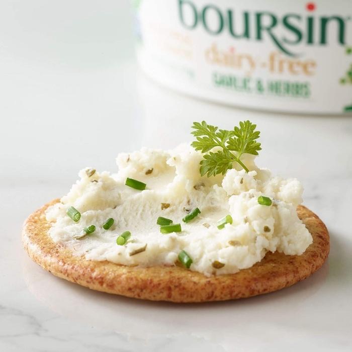 Boursin Dairy Free Cheese Spread on a cracker with chives