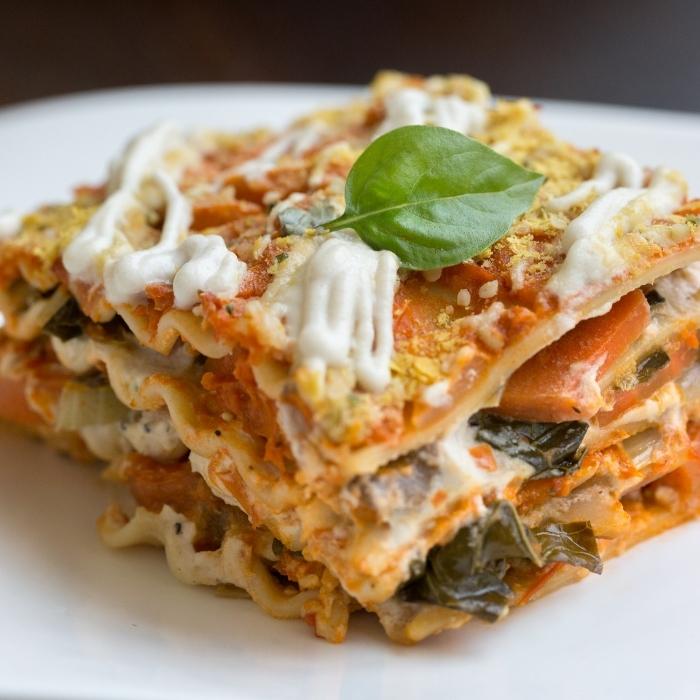 Vegan veggie lasagna with cashew sauce and nutritional yeast.