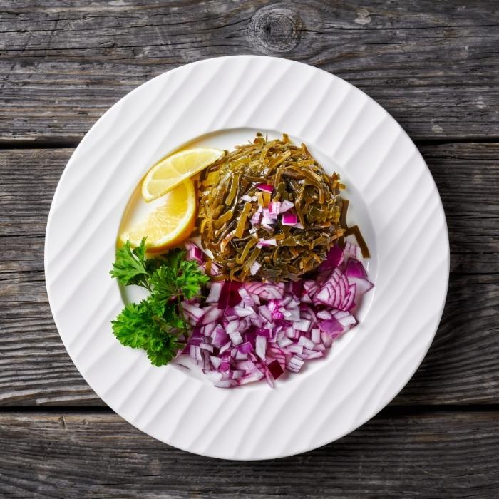 Vegan seaweed salad with red onion, lemon, and parsley