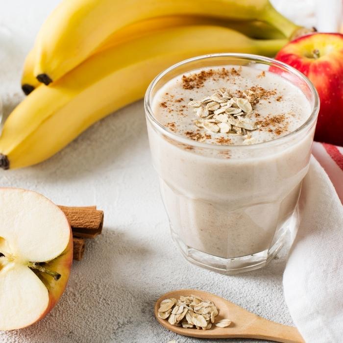 Apple and banana oatmeal smoothie in a glass.