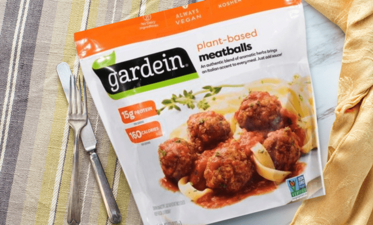 Gardein Meatballs package on a striped tablecloth with gold napkin and silverware.
