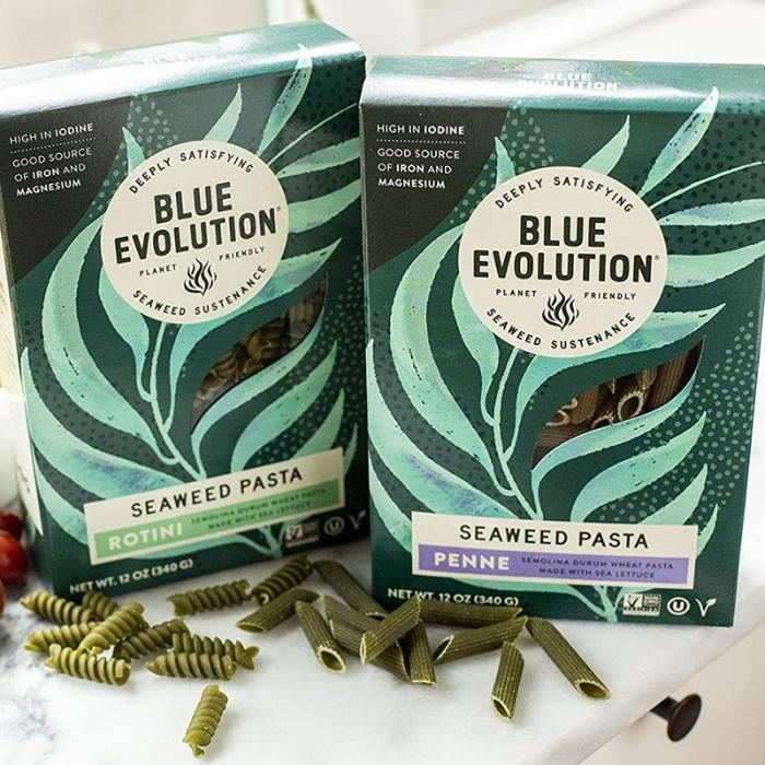 2 boxes of Blue Evolution Seaweed Pasta on a marble kitchen countertop.