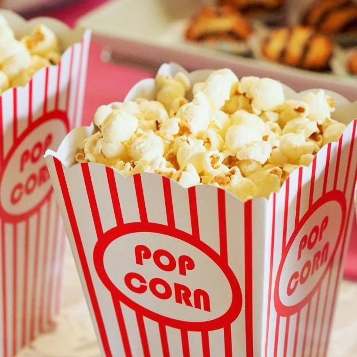 A bucket of movie theater style popcprn.
