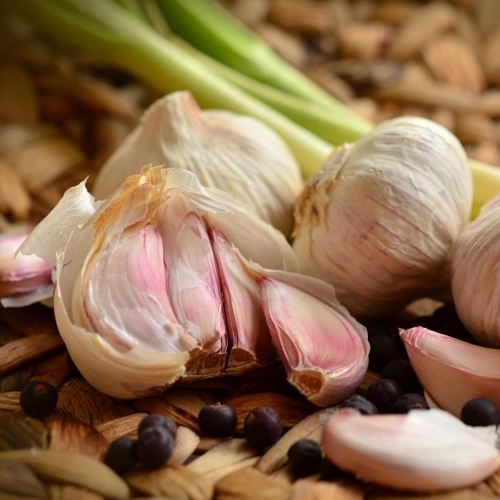 Garlic bulbs on a cutting board.